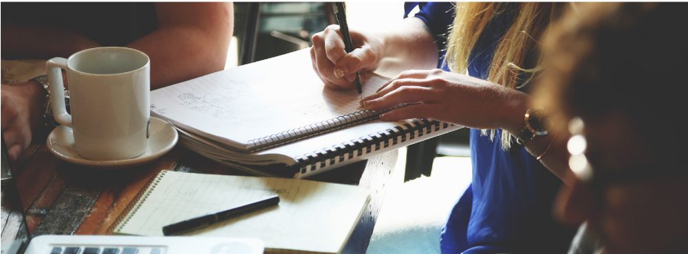 Coworking space with coffee and a notebook